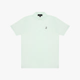 A light mint green polo shirt with a small black embroidered logo on the chest, displayed flat against a clean white background.