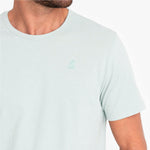 Light green t-shirt with a small green logo on a white background
