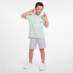 Boy wearing a light mint green polo shirt with light gray shorts