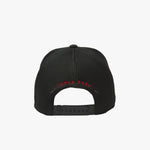 Back view of a black mesh cap with 'James Bark' logo on a white background
