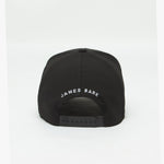 Rear view of the black cap displaying "JAMES BARK" text embroidered in white