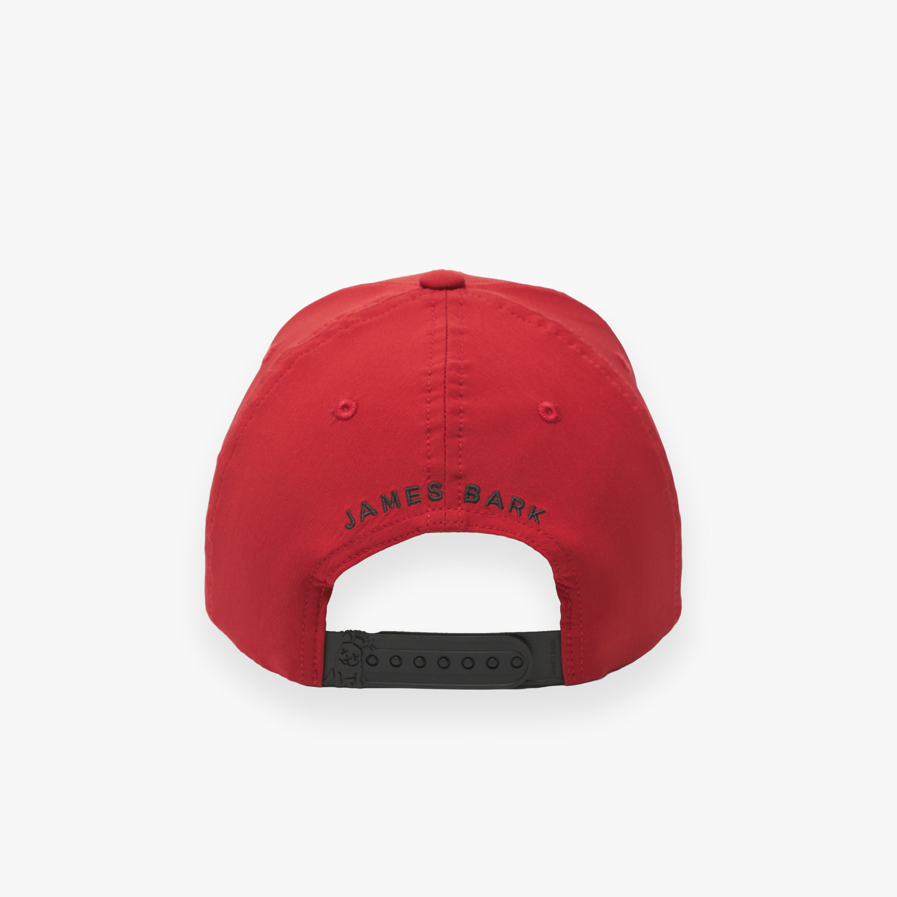 Rear view of the red cap displaying "JAMES BARK" text in black
