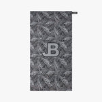 Towel with leaf pattern and JB logo on a white background