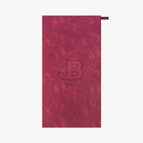 Red marble-patterned towel with 'JB' logo on a white background