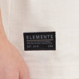 Close-up of a 'Elements' brand label on a white background