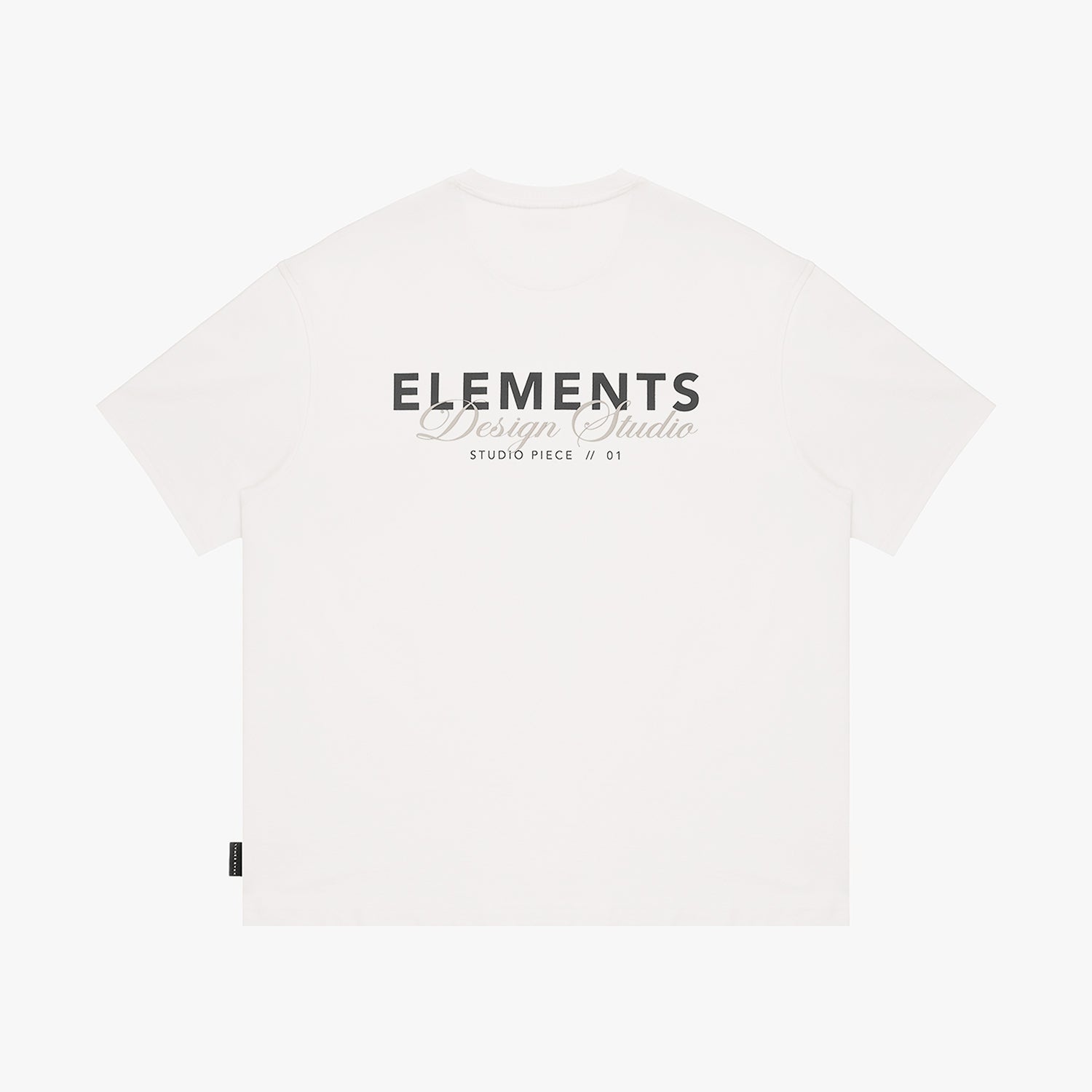 White t-shirt with 'ELEMENTS Design Studio' text on a white background