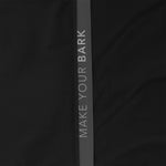 Close-up of the sleeve of a black jacket. 