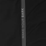 Close-up of the sleeve of a black jacket. 