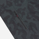 Close-up of the pocket of a camouflage patterned jacket.