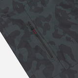 Close-up of the pocket of a camouflage patterned jacket.