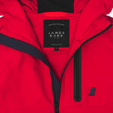 Close-up of the inside of a red jacket. A black label reads "SPECIAL EDITION JAMES BARK." The lining is dark blue.