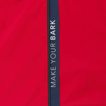 Close-up of the sleeve of a red jacket. 