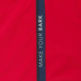 Close-up of the sleeve of a red jacket. 