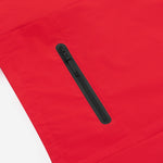 Close-up of the chest pocket of a red jacket. 