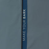 Close-up of the sleeve of a slate blue jacket.