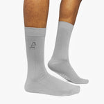 Gray socks with a logo on a white background