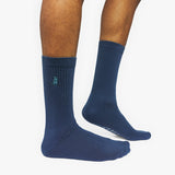 Blue socks with a brand logo on a white background