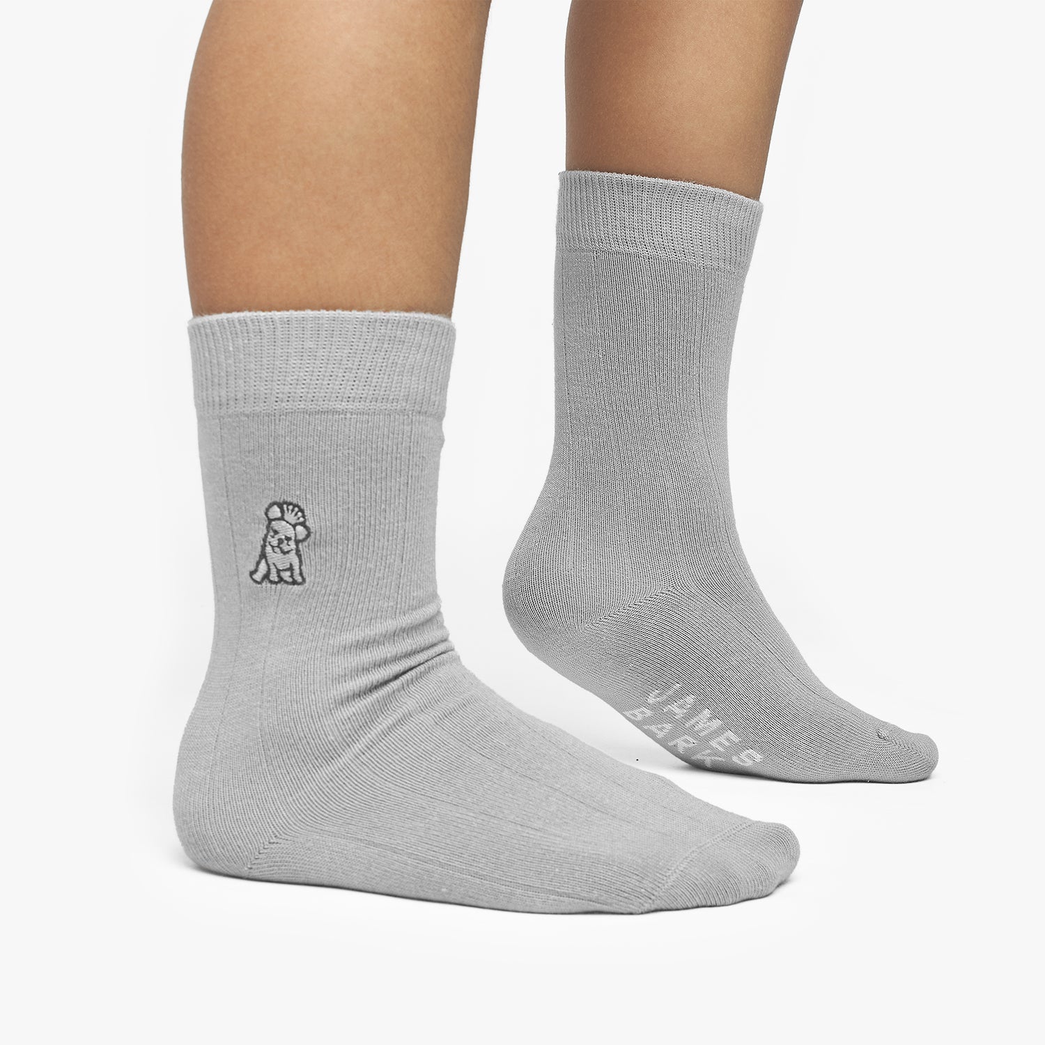Gray socks with a small logo on a white background