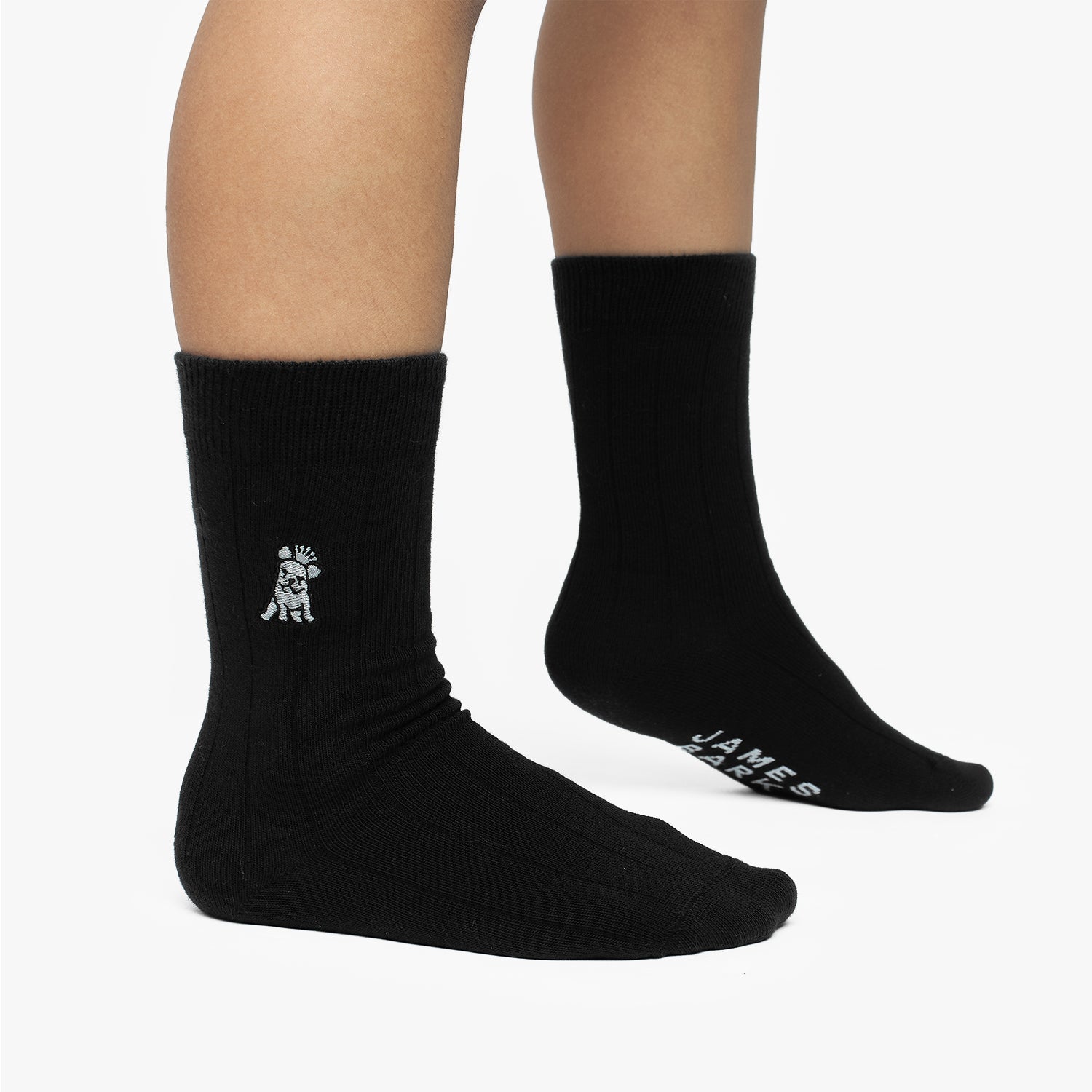 Black socks with a logo and text on a white background