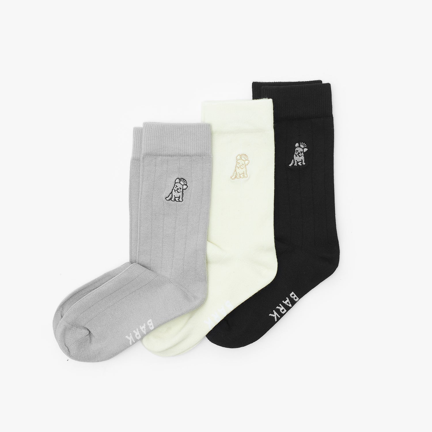 Three pairs of socks in gray, white, and black with a brand logo on a white background