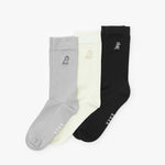 Three socks in gray, white, and black with a brand logo on a white background