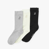Three socks in gray, white, and black with a brand logo on a white background
