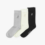 Three socks in gray, white, and black with a brand logo on a white background
