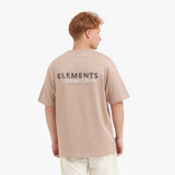 Male model showing the back of the beige t-shirt with the "ELEMENTS Design Studio" graphic