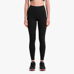 Person wearing black leggings on a white background