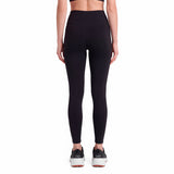 Person wearing black leggings on a white background