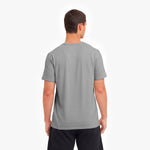 Man wearing a gray t-shirt on a white background