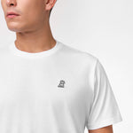 White t-shirt with a small black logo on a white background