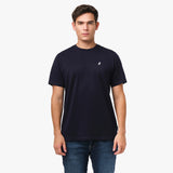 Man wearing a navy blue t-shirt with a small logo on a white background