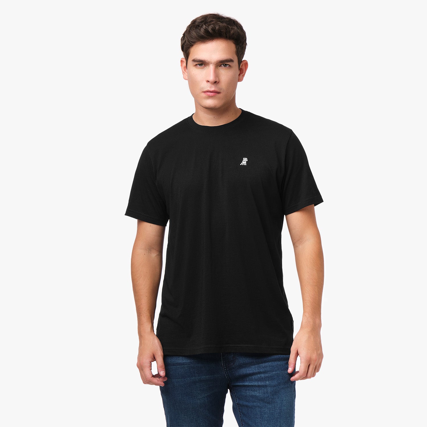 Man wearing a black t-shirt with a small logo on a white background