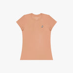 Peach-colored t-shirt with a small logo on a white background