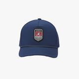 Front view of a navy blue cap. The central patch features a dog logo.