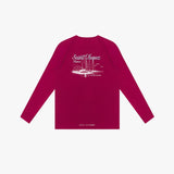 Back picture of a red long-sleeve rashguard with white graphic design on a light gray background