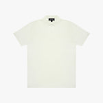 White polo shirt on a light beige background