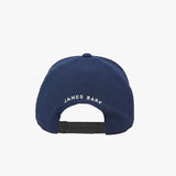 Rear view of the navy blue cap. "JAMES BARK" is embroidered in white text 