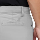 Close-up of gray pants with a brand logo on a white background