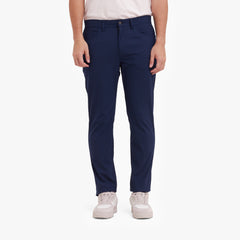 Person wearing navy pants on a white background