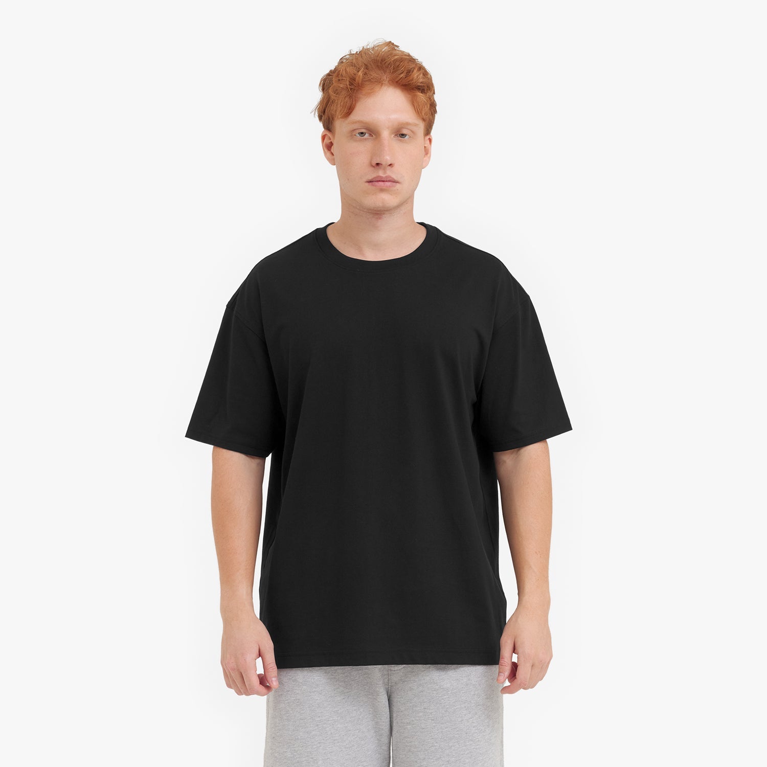 Person wearing a black t-shirt on a white background