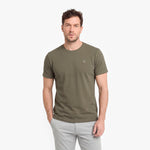 Man wearing an olive green t-shirt on a white background