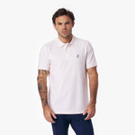 Man wearing a light pink polo shirt on a white background