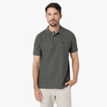 Man wearing a green polo shirt on a white background
