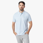 Man wearing a light blue polo shirt on a white background