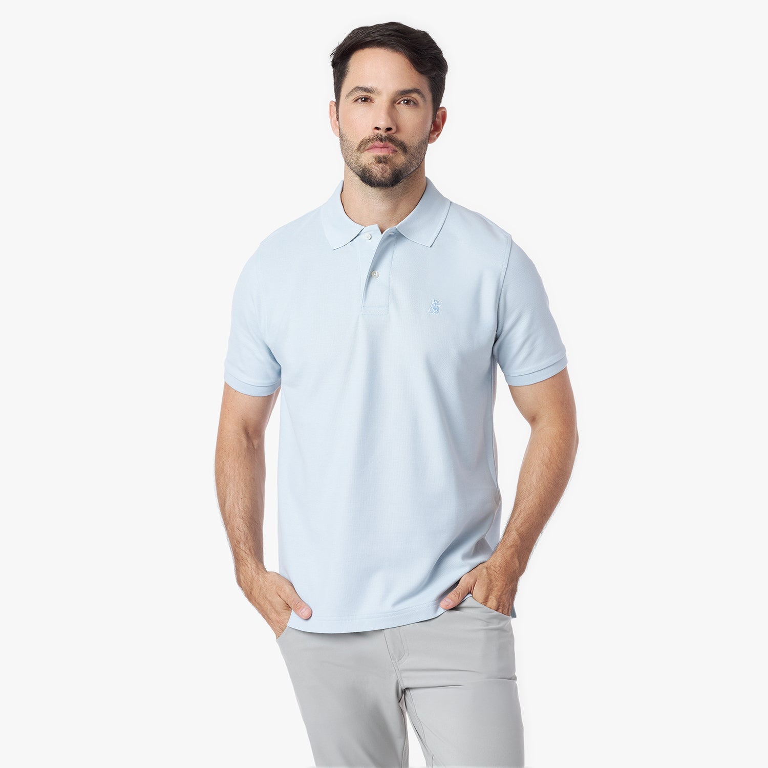 Man wearing a light blue polo shirt on a white background