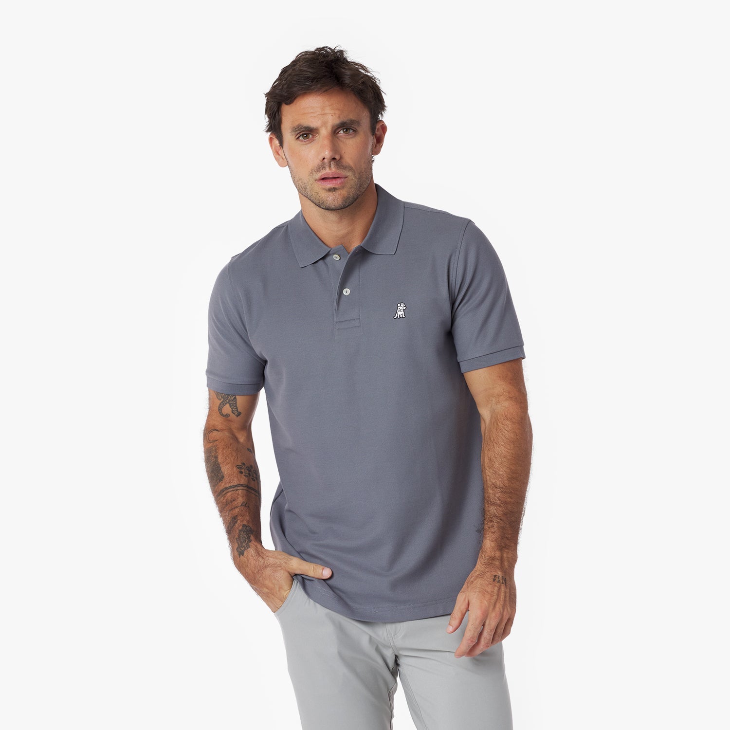 Man wearing a gray polo shirt on a white background