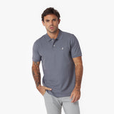 Man wearing a gray polo shirt on a white background