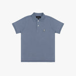 A dusty blue polo shirt with a three-button placket and a small embroidered dog logo on the left chest, displayed flat against a light gray background.